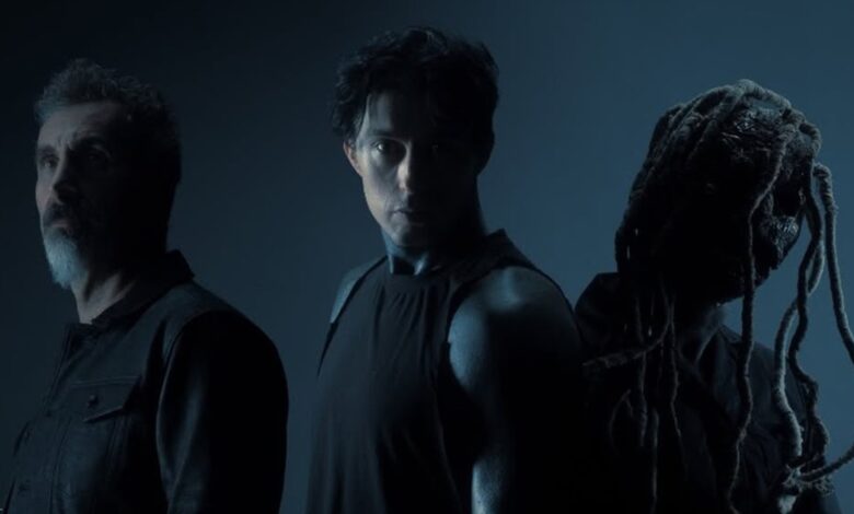 Serj Tankian, Ronnie Radke and Corey Taylor in a dark blue promotional portrait for Falling In Reverse’s Joseph