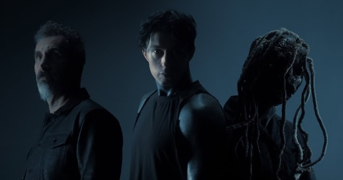 Serj Tankian, Ronnie Radke and Corey Taylor in a dark blue promotional portrait for Falling In Reverse’s Joseph