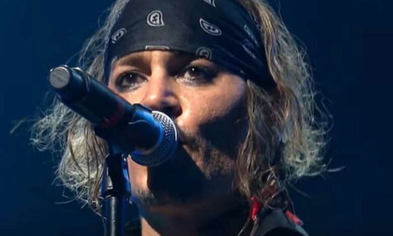 Johnny Depp singing into a microphone with Hollywood Vampires at the Montreux Jazz Festival