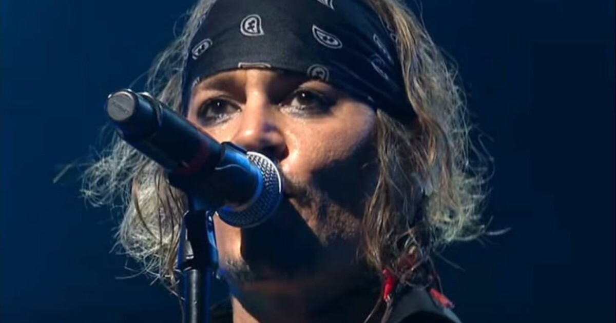 Johnny Depp singing into a microphone with Hollywood Vampires at the Montreux Jazz Festival