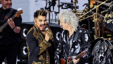 Adam Lambert singing beside Brian May on guitar at Queen’s 2022 Platinum Jubilee performance.