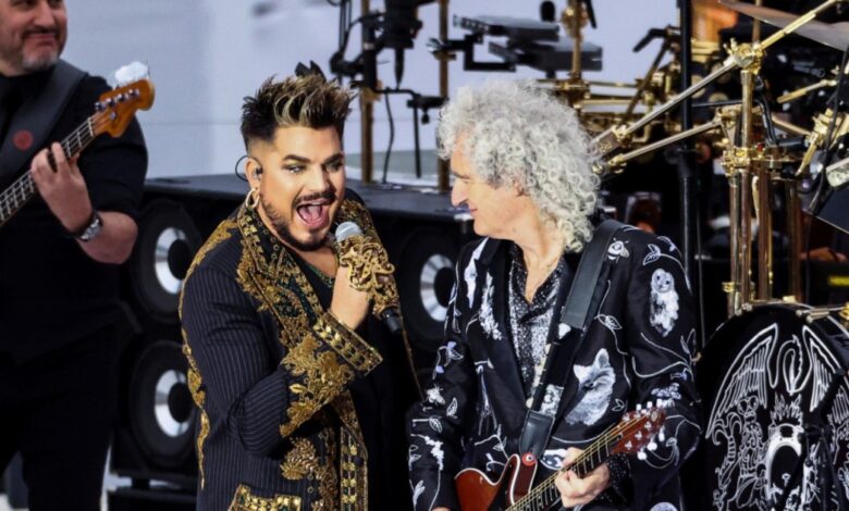 Adam Lambert singing beside Brian May on guitar at Queen’s 2022 Platinum Jubilee performance.