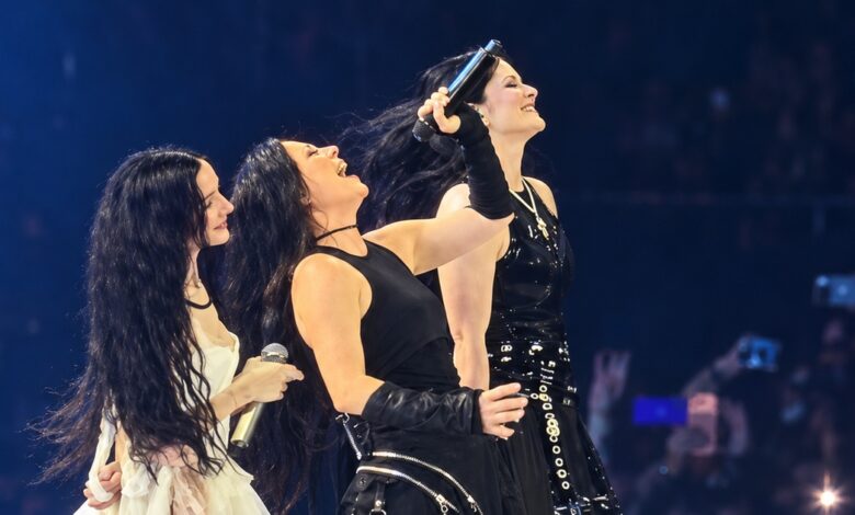 Stylised concert image of Poppy, Amy Lee and Courtney LaPlante on stage.
