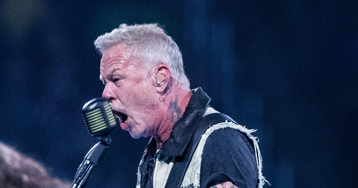 James Hetfield singing into a vintage microphone onstage