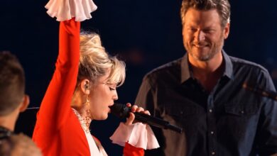 Miley Cyrus sings Dream On with one arm raised as Blake Shelton smiles behind her on The Voice