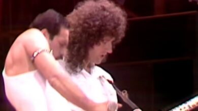 Freddie Mercury beside Brian May during Queen’s Live Aid performance.