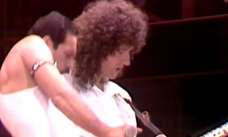Freddie Mercury beside Brian May during Queen’s Live Aid performance.