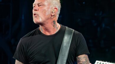 James Hetfield in a black T-shirt with white guitar